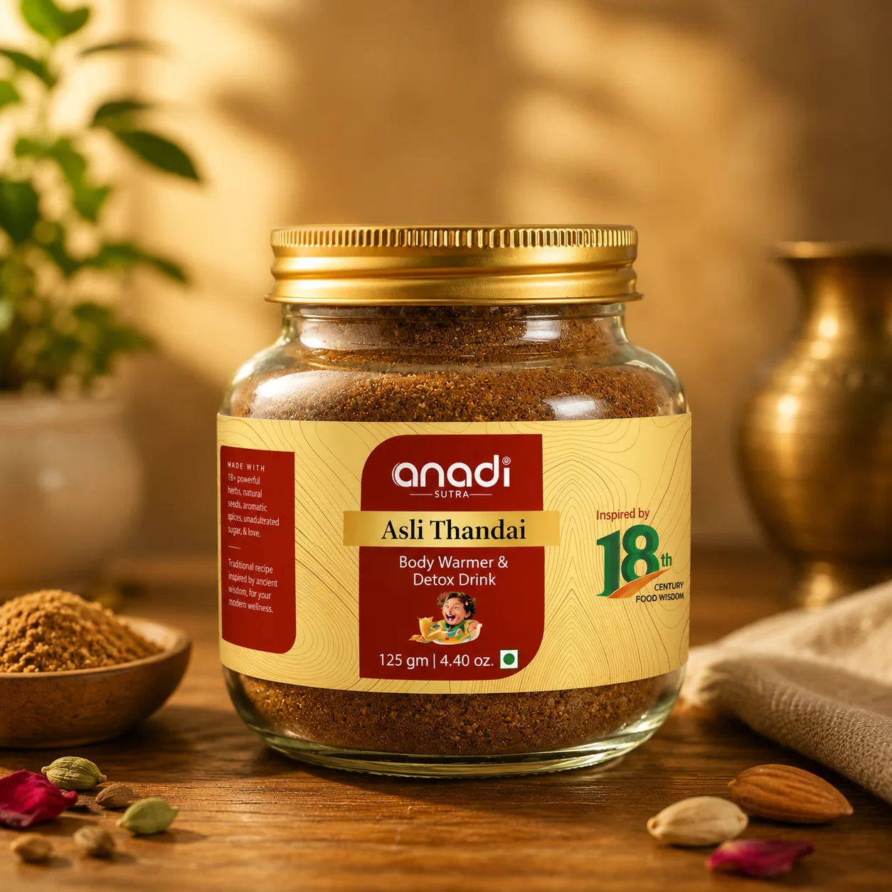 Glass jar of Asli Thandai body warmer drink, 125 g, with gold lid and label