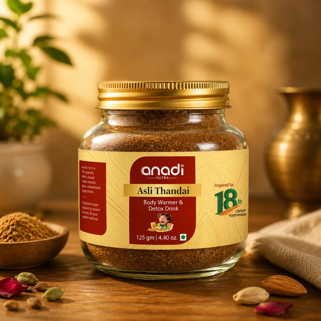 Glass jar of Asli Thandai body warmer drink, 125 g, with gold lid and label