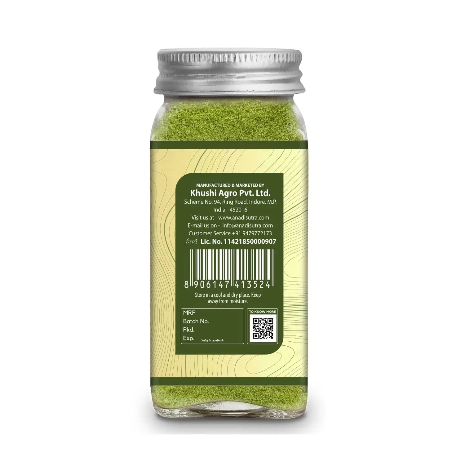 Green herb powder jar with silver lid and back label