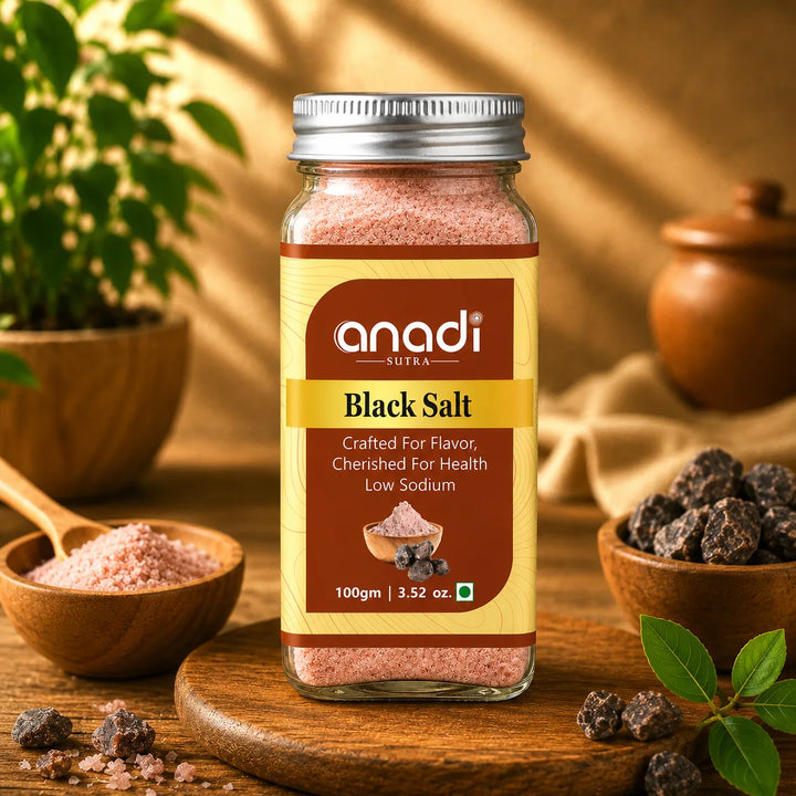 anadi SUTRA black salt jar, 100 g, with bowls of pink salt and dark salt rocks nearby