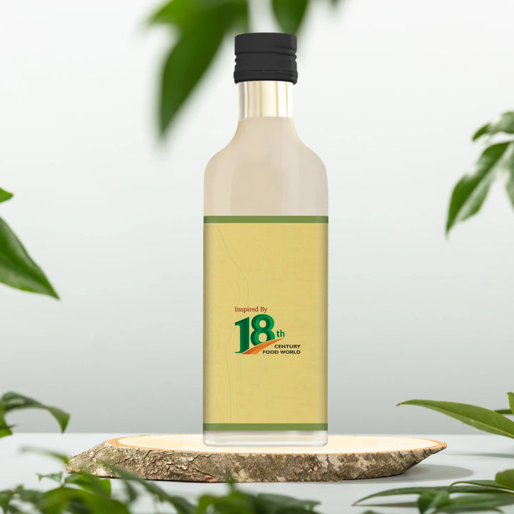 Virgin coconut oil bottle with black cap, 20 ml, front label graphic visible