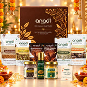 Brown Anadi Sutra Diwali gift hamper box with snack packets and golden jars