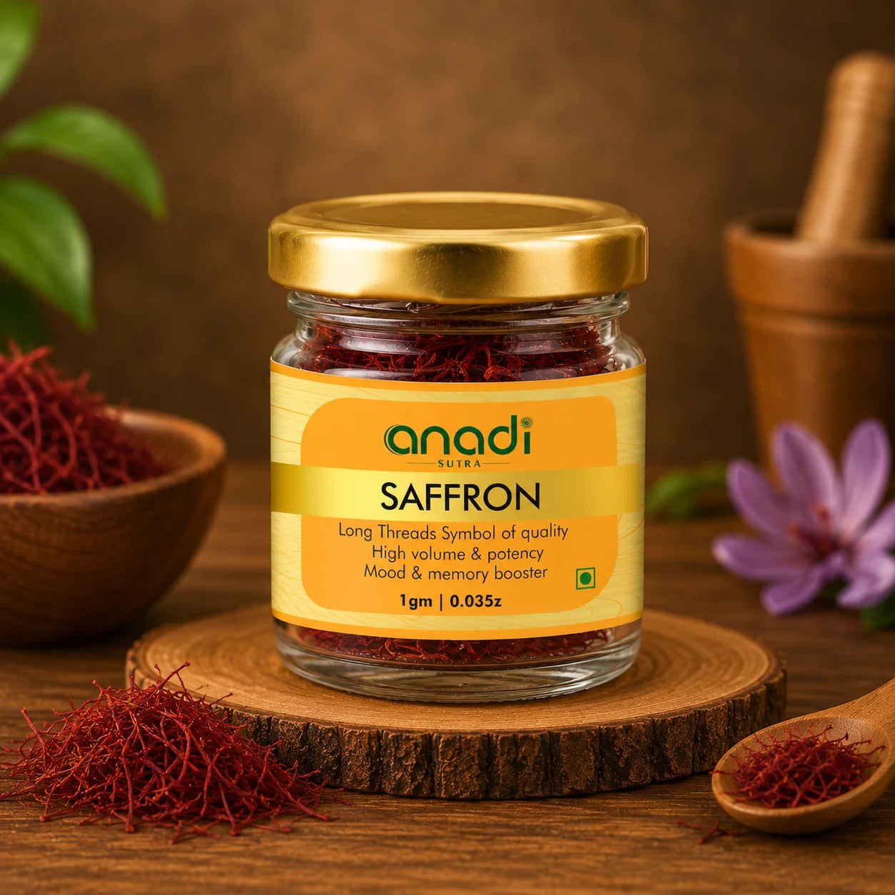 anadi SUTRA saffron spice jar with gold lid, red saffron threads and small spoon