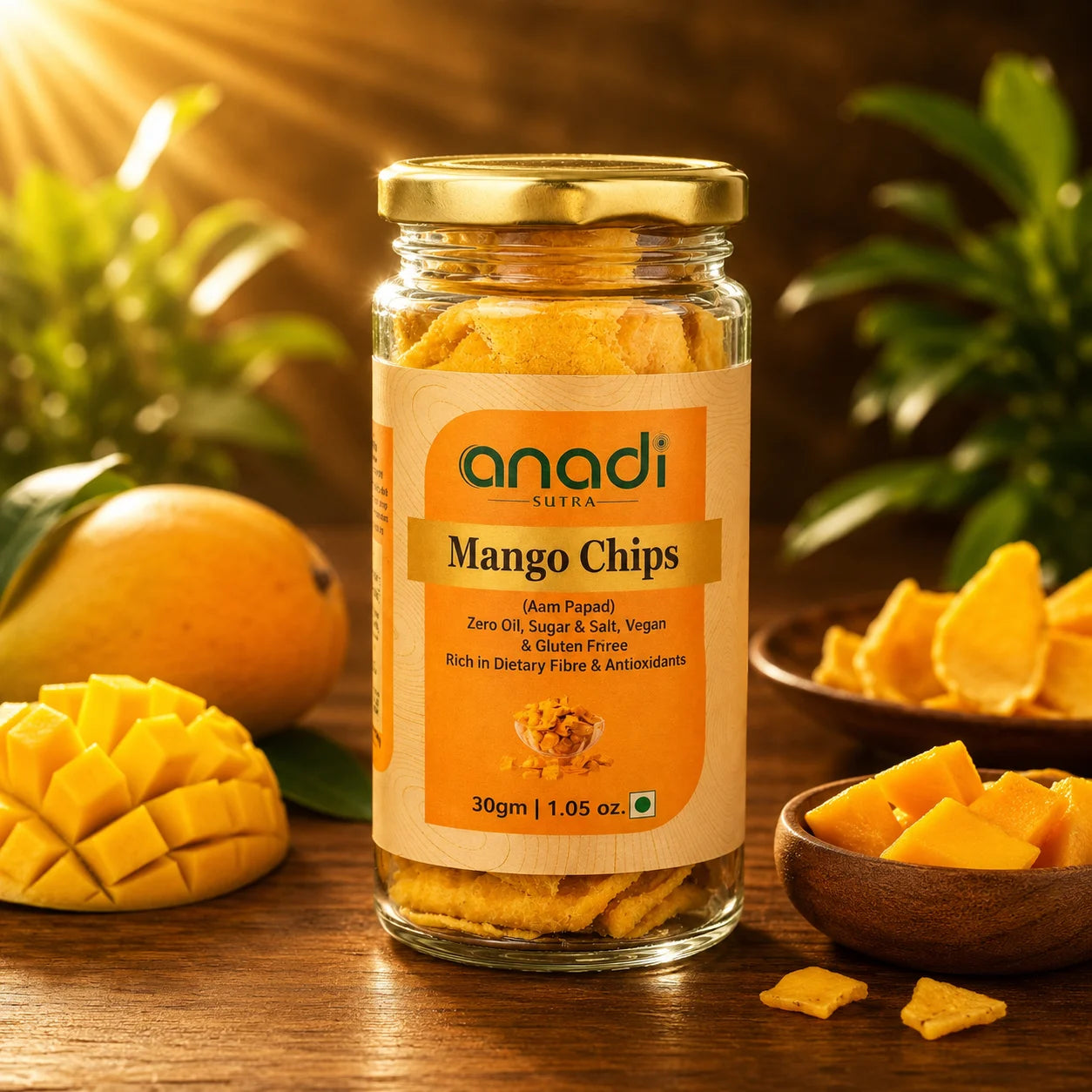 anadi mango chips glass jar with golden mango pieces and serving bowl