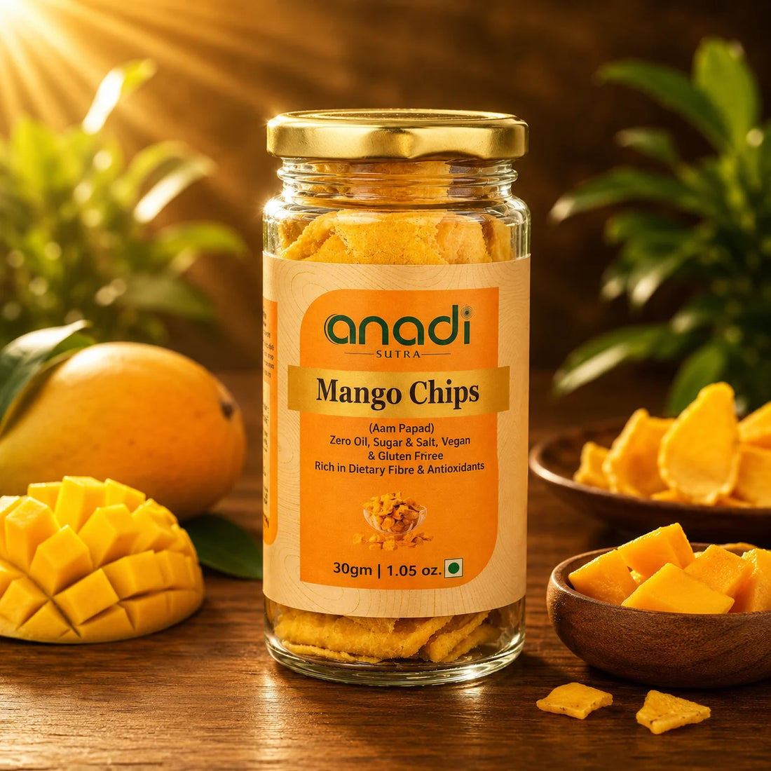 anadi mango chips glass jar with golden mango pieces and serving bowl