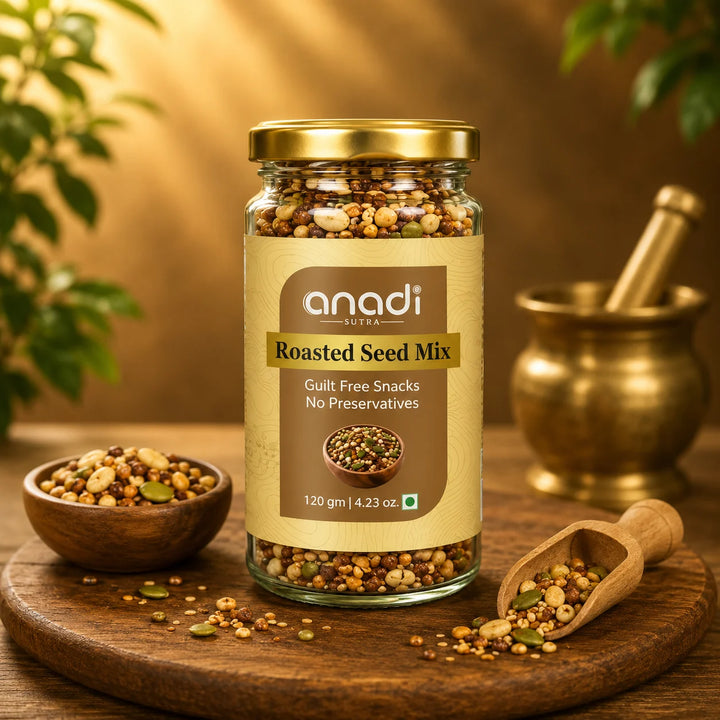Seed mix jar with gold lid on a wooden board with small bowls of roasted seeds