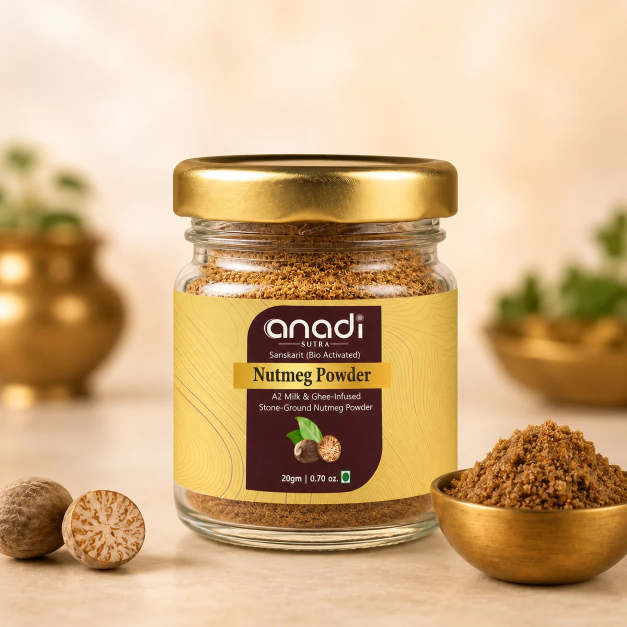 Close-up nutmeg powder glass jar with gold lid and ground nutmeg in bowl