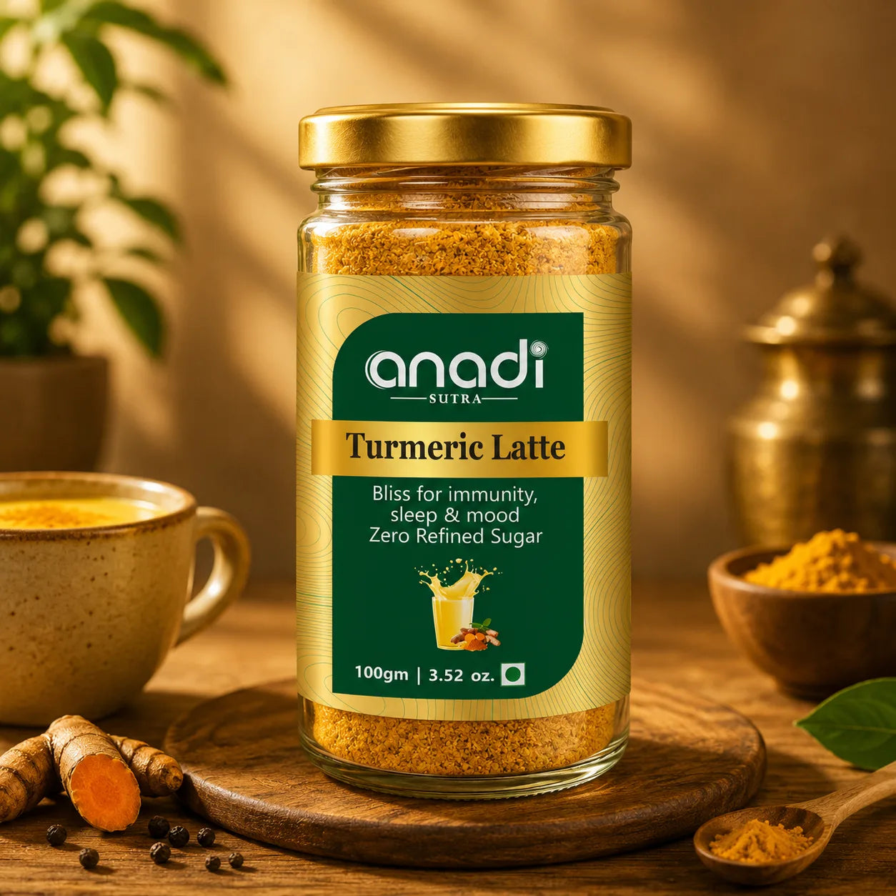 Turmeric latte jar with anadi label, cup of golden latte, and turmeric sticks