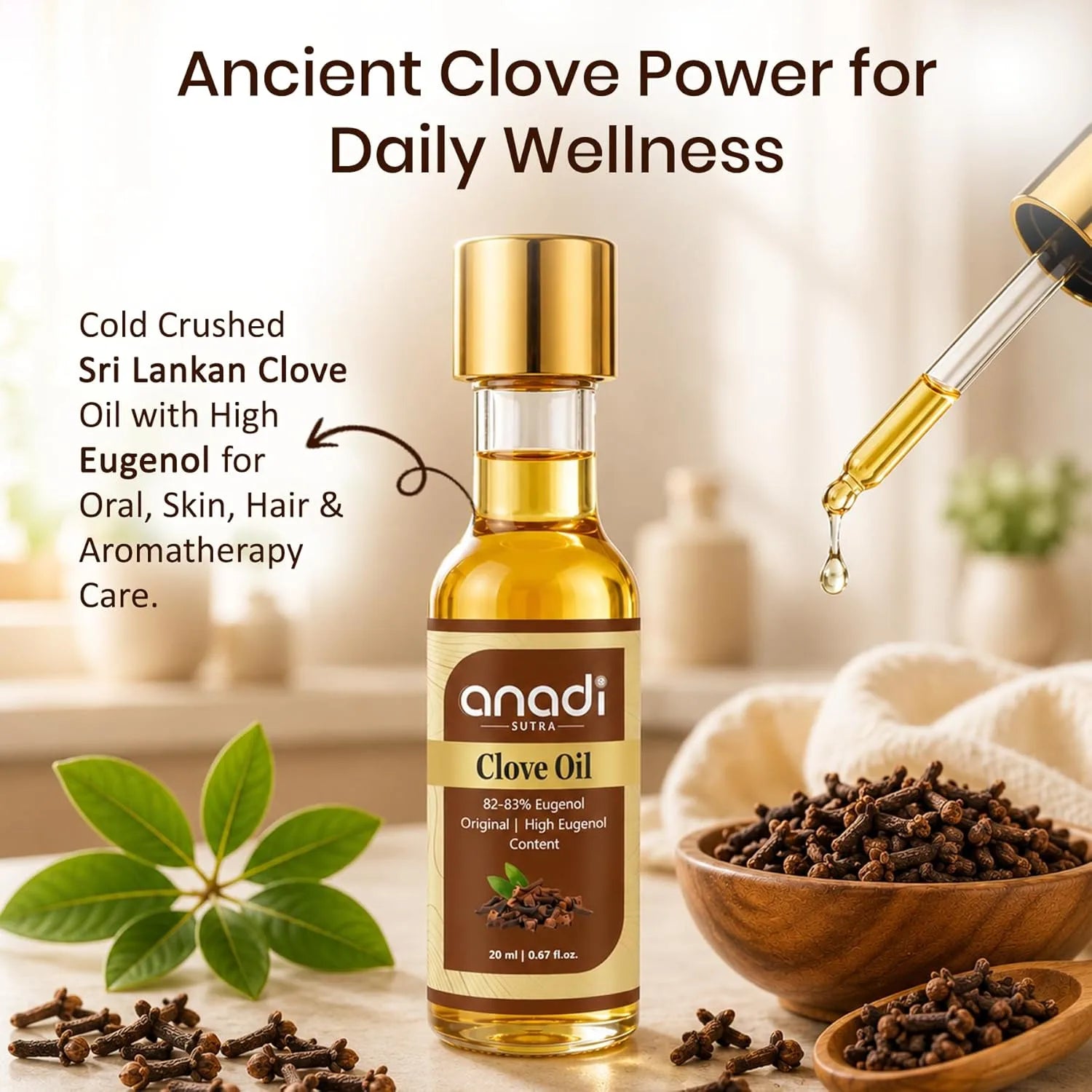 Anadi Sutra clove oil bottle, gold cap, amber liquid, with whole cloves around