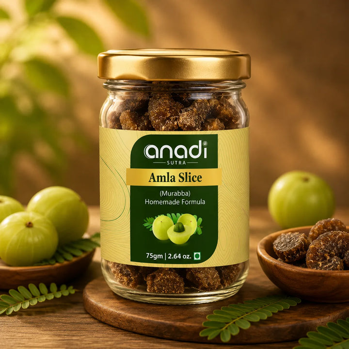 Glass amla slice jar with gold lid and green label, filled with dark dried pieces