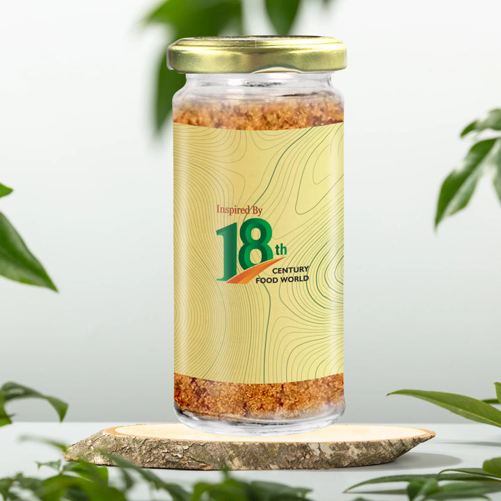 Jaggery powder jar with gold-green front label and brown granules