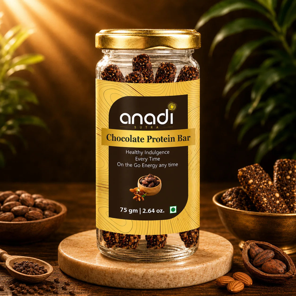 anadi Chocolate Protein Bar in glass jar with gold lid, dark cocoa pieces visible