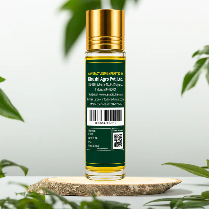 Pain relief oil applicator bottle, dark green with gold cap and back label