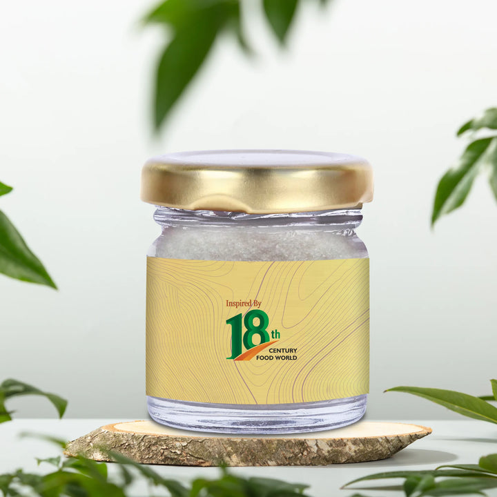 Alum crystal jar with gold lid and 18th-century food world logo